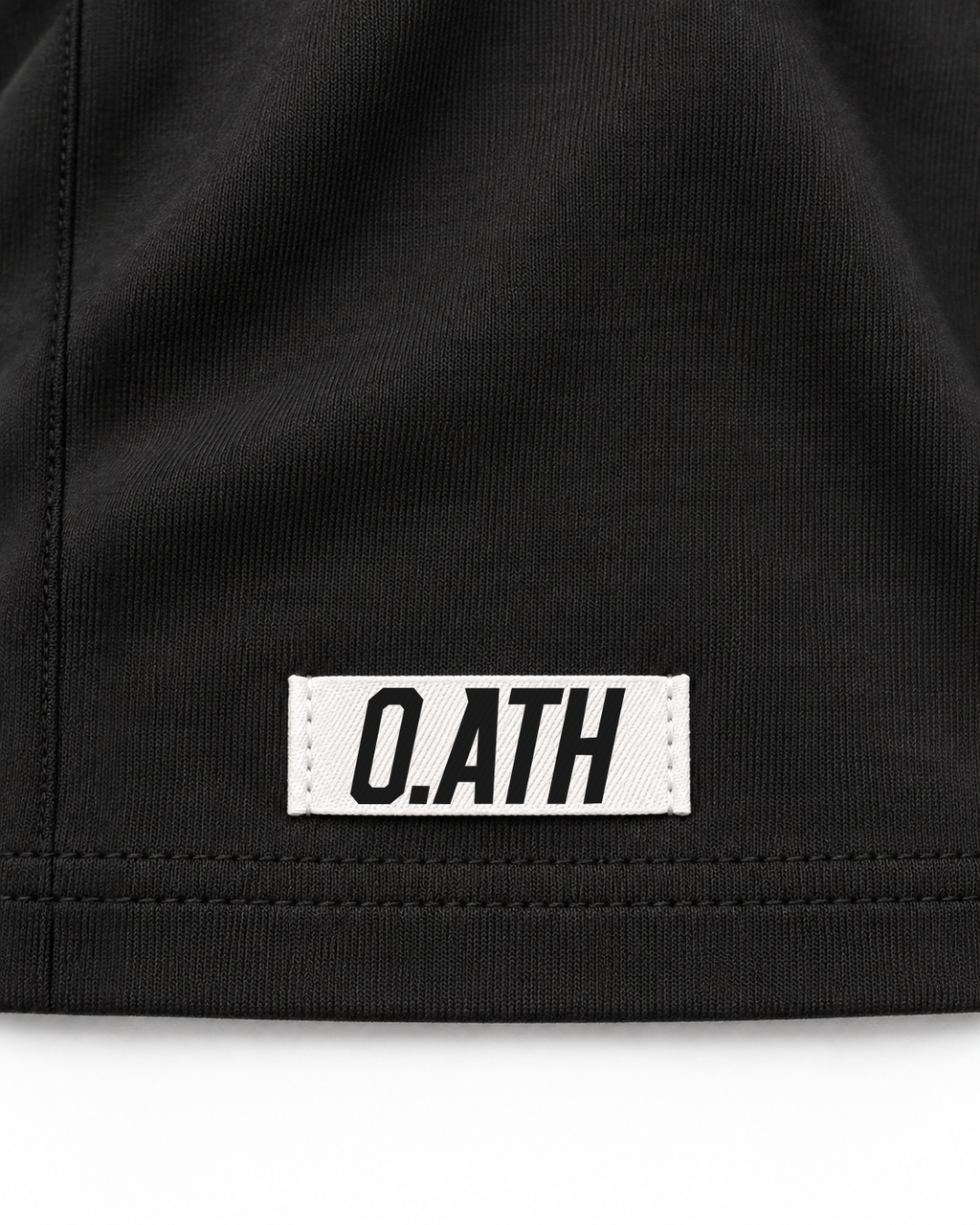 O.ATH Original Form Supima long sleeve in Black — woven label and fabric detail