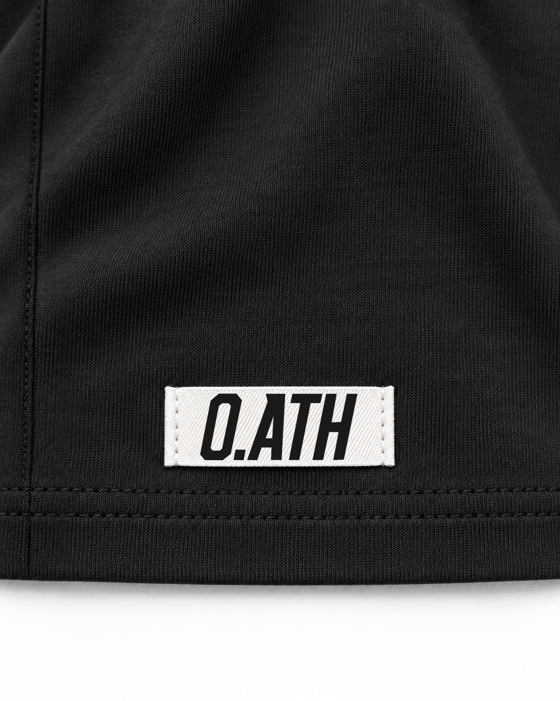 O.ATH Original Form Supima long sleeve in Black — woven label and fabric detail