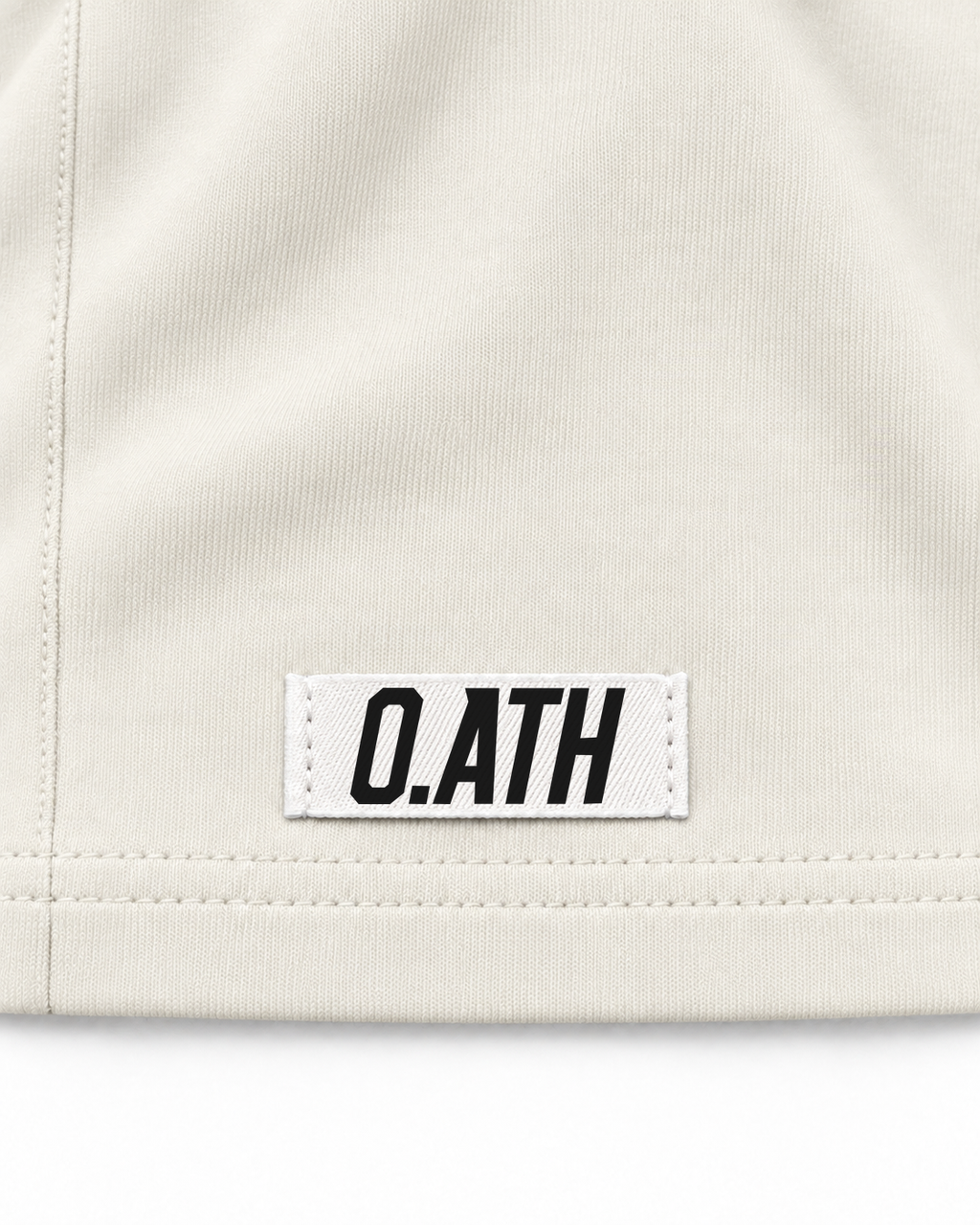O.ATH Original Form Supima long sleeve in Natural — woven label and fabric detail