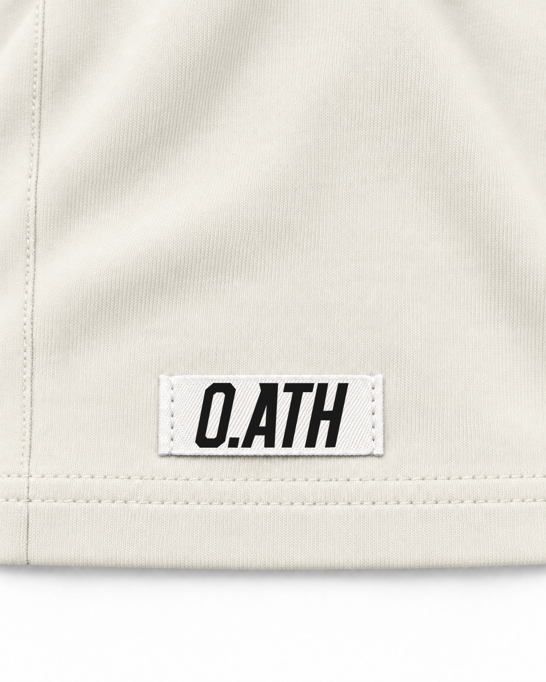 O.ATH Original Form Supima long sleeve in Natural — woven label and fabric detail