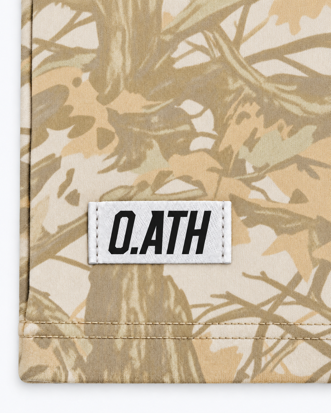 O.ATH Original Form Woodland Camo Heavyweight Tee white woven label and washed organic cotton fabric detail