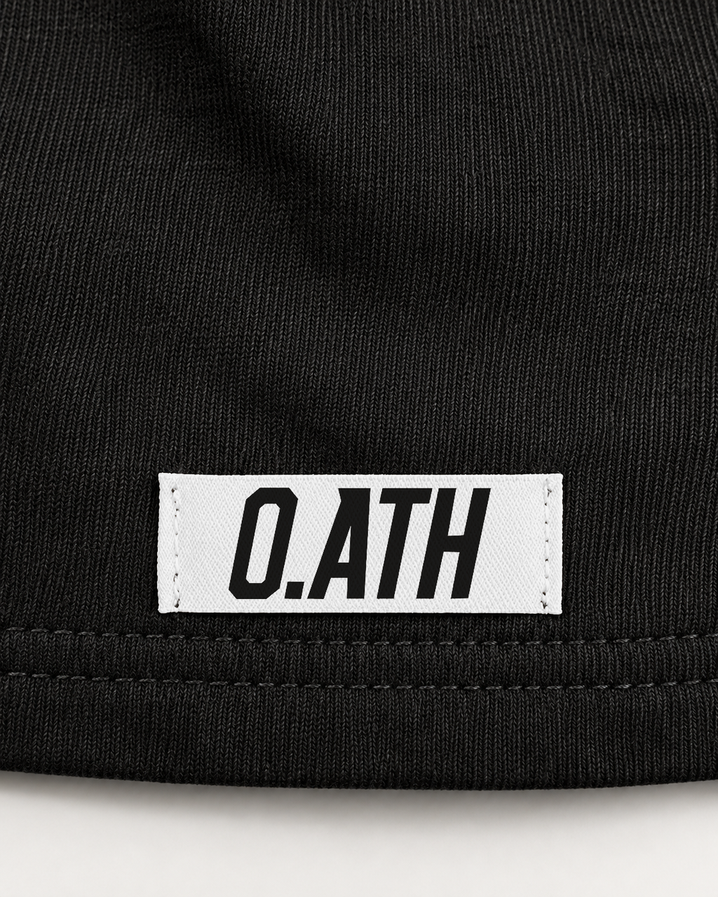 O.ATH Original Form hemp shorts in Black — woven label and fabric detail