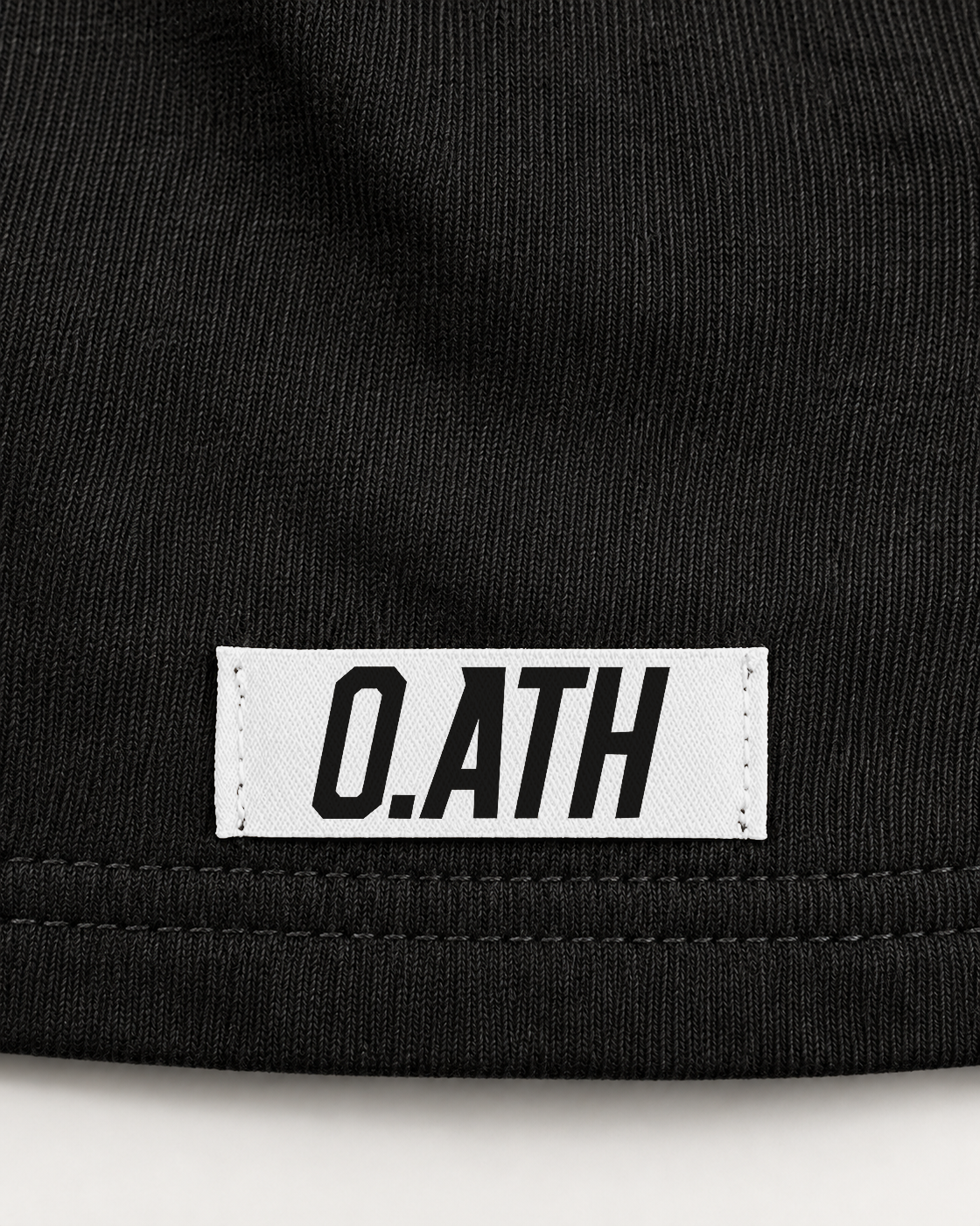 O.ATH Original Form hemp shorts in Black — woven label and fabric detail