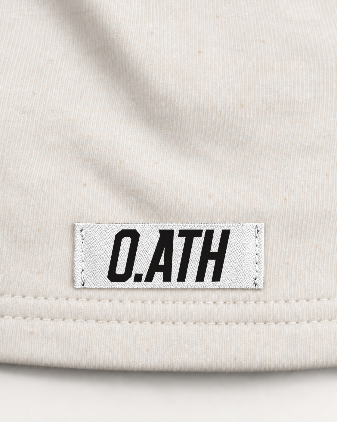 O.ATH Original Form hemp shorts in Natural — woven label and fabric detail