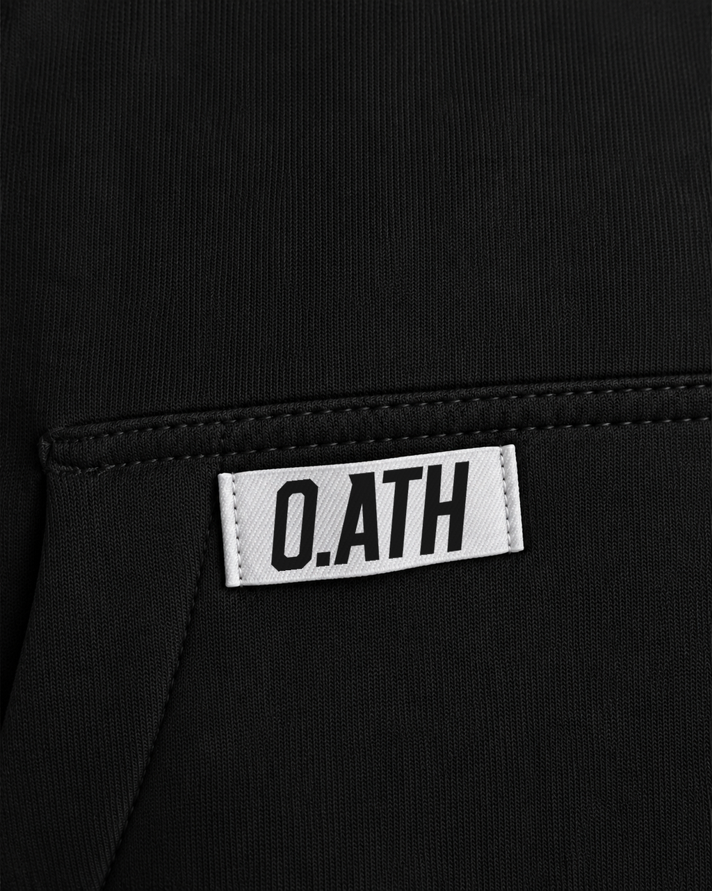O.ATH Original Form hoodie in Black — woven label and fabric detail
