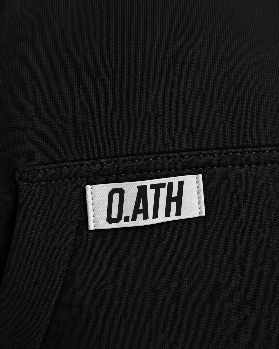 O.ATH Original Form hoodie in Black — woven label and fabric detail