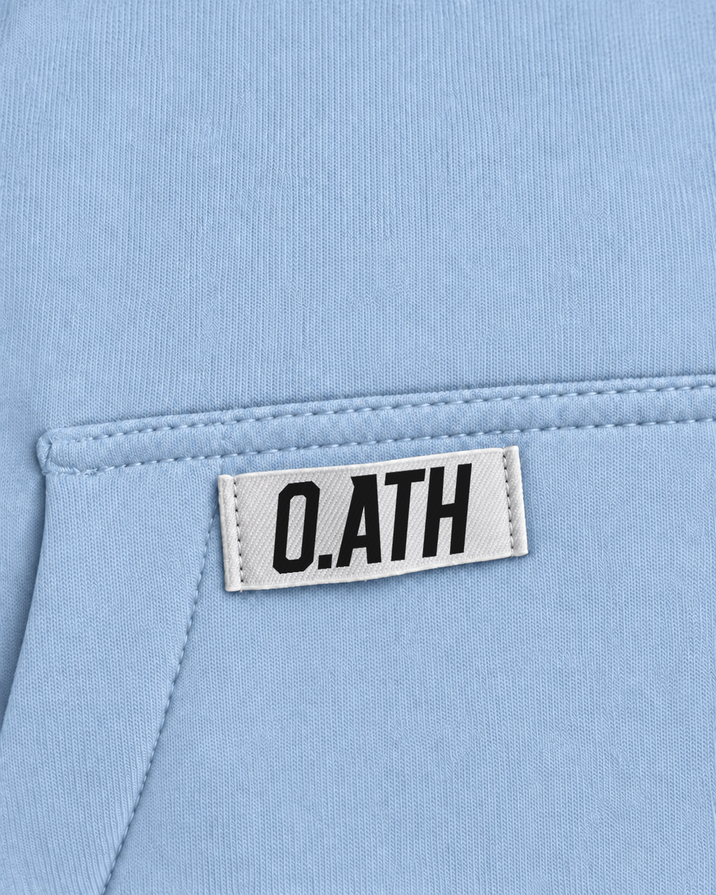 O.ATH Original Form hoodie in Blue — woven label and fabric detail